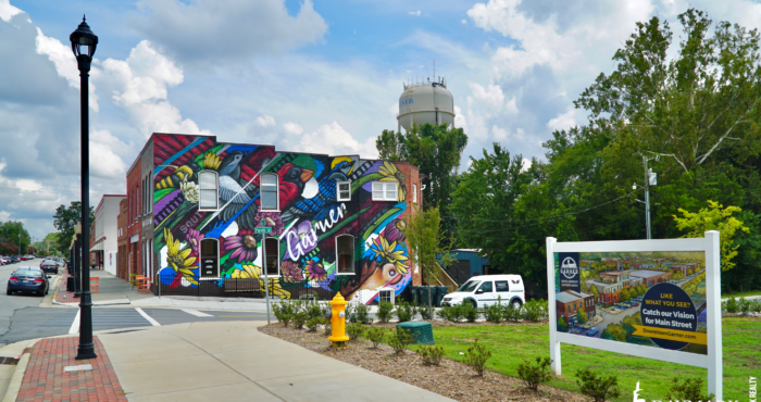 View of the iconic and brightly painted Full Bloom Coffee building on Main Street.